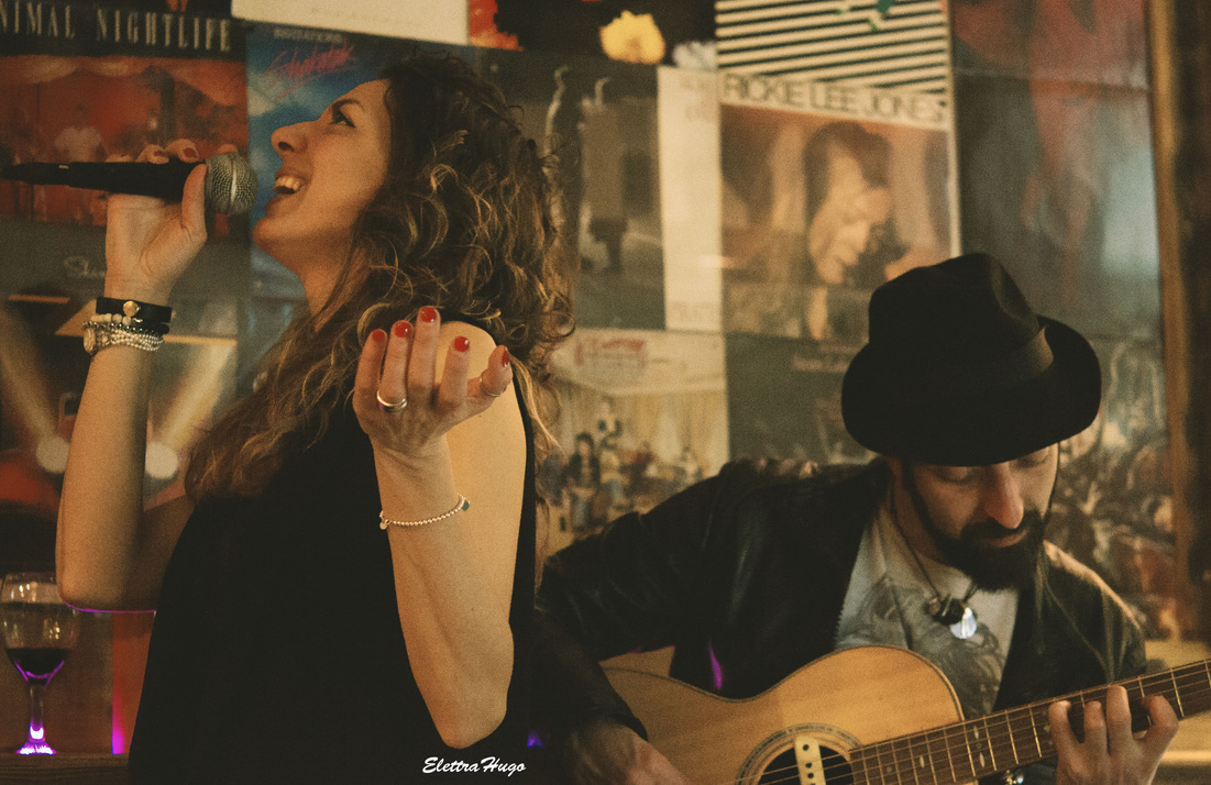 Live music performance with guitar and voice